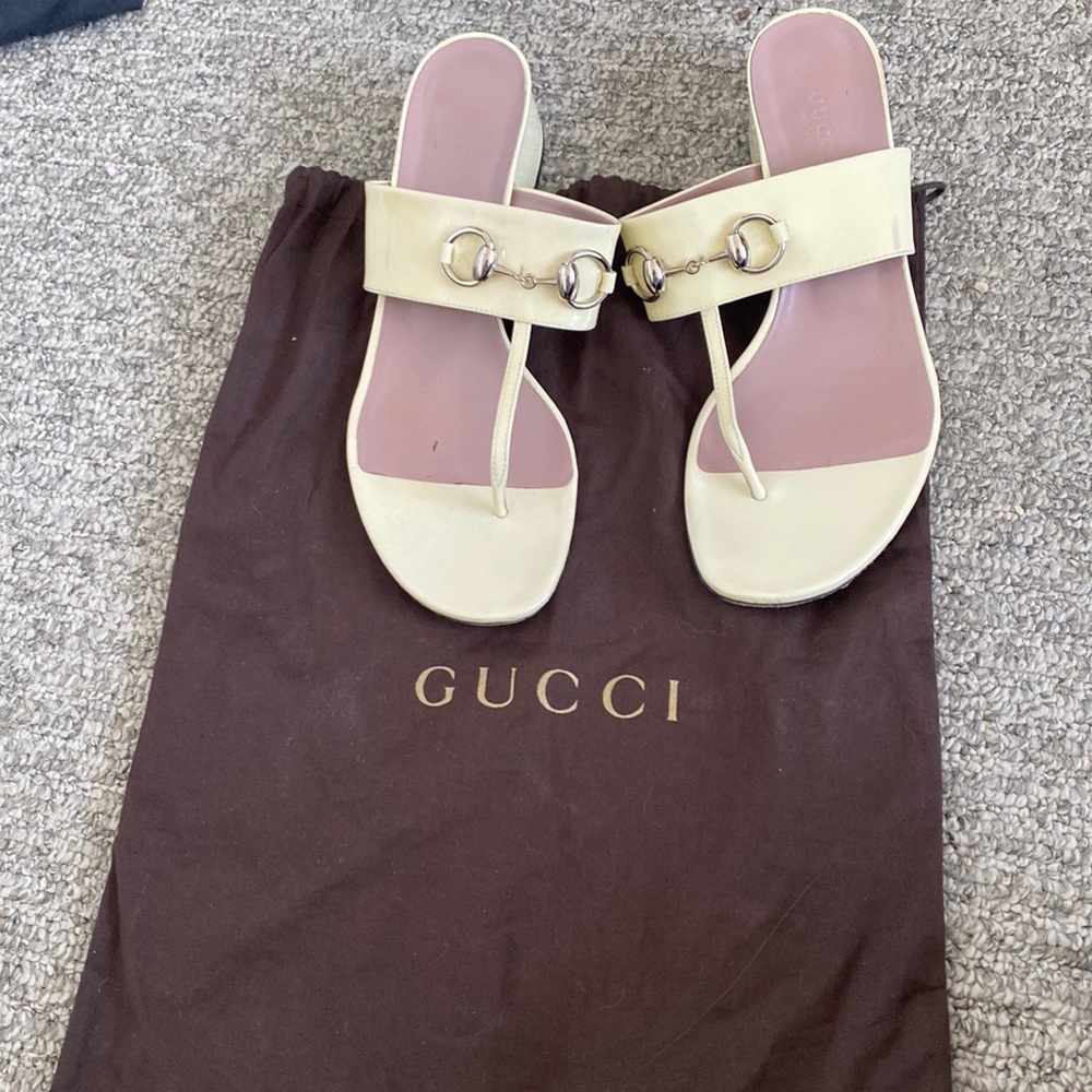 White Gucci sandals with silver buckle